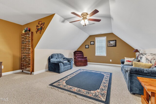 carpeted living area with visible vents, a ceiling fan, baseboards, and vaulted ceiling