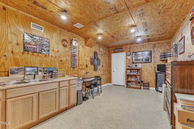 office space featuring a sink, baseboards, attic access, and visible vents
