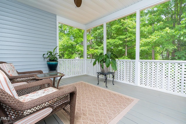 sunroom / solarium with ceiling fan