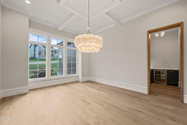 unfurnished dining area featuring beam ceiling, an inviting chandelier, light wood-style flooring, and wine cooler