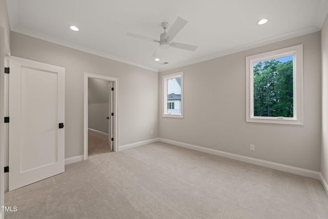 unfurnished bedroom with crown molding, recessed lighting, baseboards, and light carpet