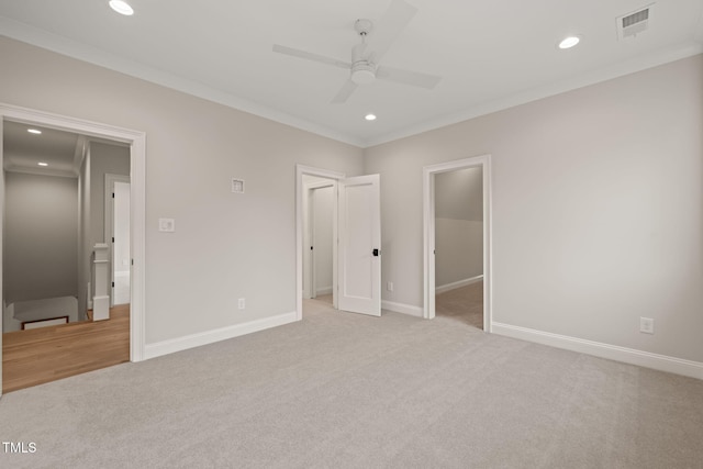 unfurnished bedroom featuring carpet floors, recessed lighting, a spacious closet, and visible vents
