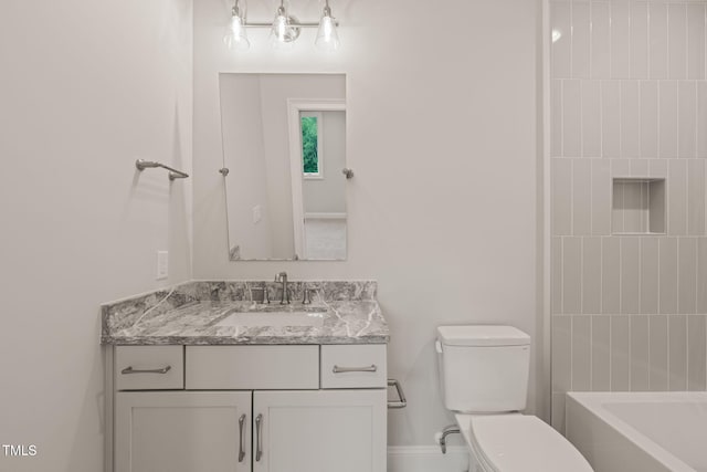 full bathroom featuring vanity and toilet