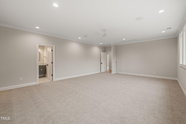 unfurnished room featuring recessed lighting, light colored carpet, and ornamental molding