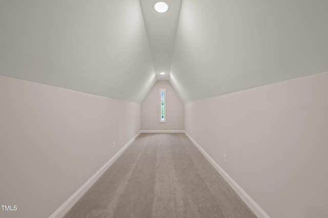 bonus room featuring baseboards, light carpet, vaulted ceiling, and recessed lighting