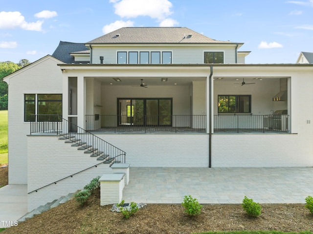 back of house featuring a patio, ceiling fan, stairs, and a sunroom