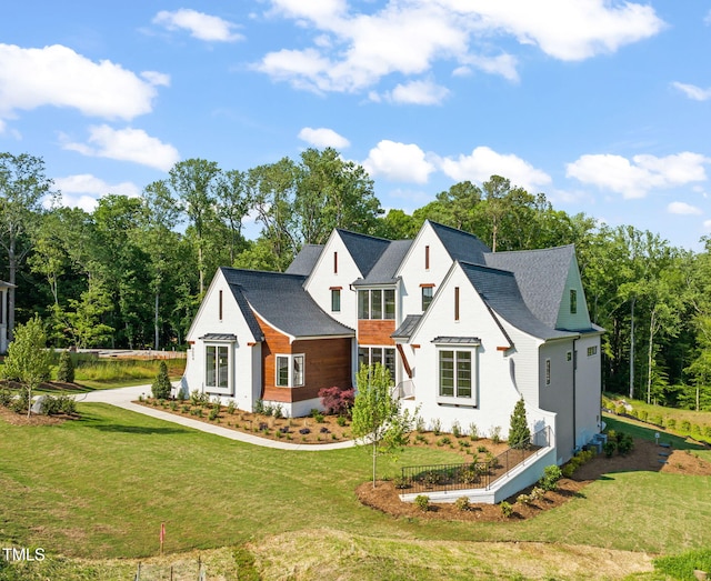 modern farmhouse with a front lawn
