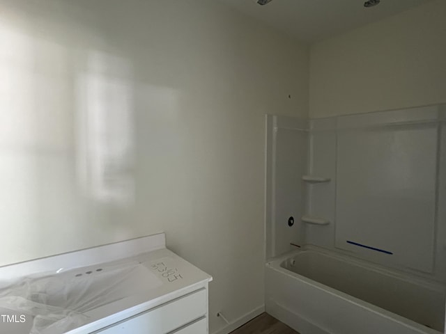 183 Pecan Valley Way, Four Oaks, NC 27524 - full bath featuring shower / tub combination, vanity, wood finished floors, and baseboards