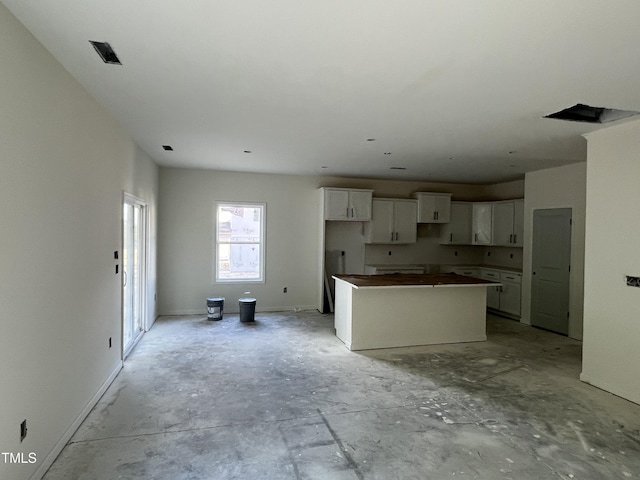 183 Pecan Valley Way, Four Oaks, NC 27524 - kitchen featuring a kitchen island and white cabinetry