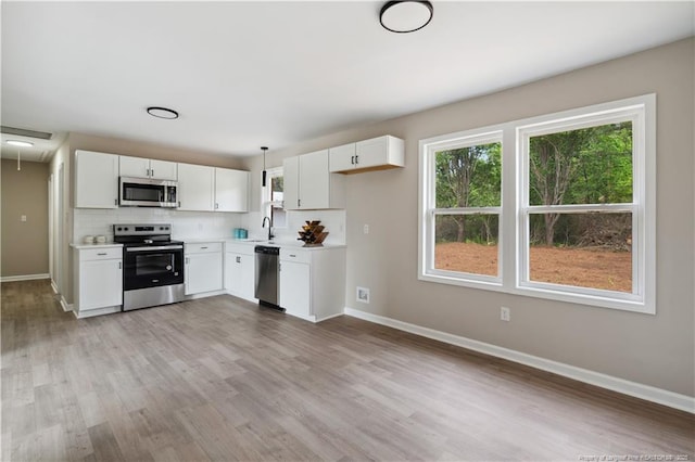 11504 Bissette Rd, Middlesex, NC 27557 - kitchen featuring baseboards, light countertops, stainless steel appliances, and a sink