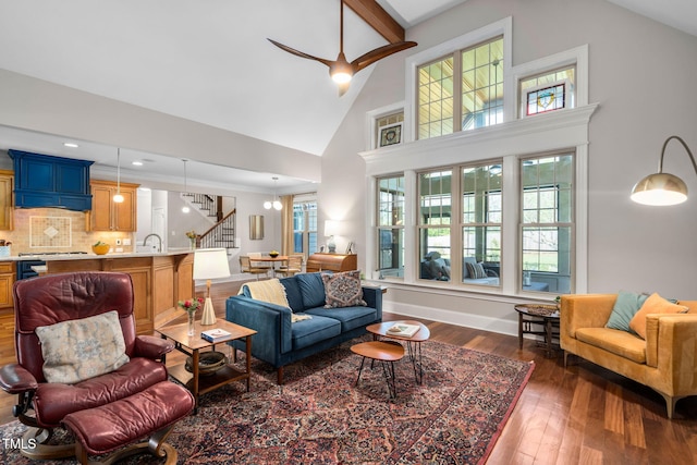 154 Sicily Dr, Clayton, NC 27527 - living room featuring dark wood-style floors, high vaulted ceiling, stairway, baseboards, and ornamental molding