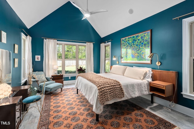 154 Sicily Dr, Clayton, NC 27527 - bedroom featuring wood finished floors, high vaulted ceiling, baseboards, and a ceiling fan
