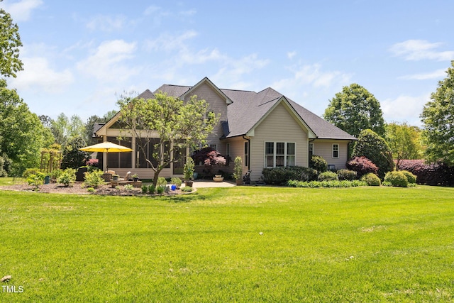 154 Sicily Dr, Clayton, NC 27527 - rear view of house featuring a lawn, a patio, and a shingled roof
