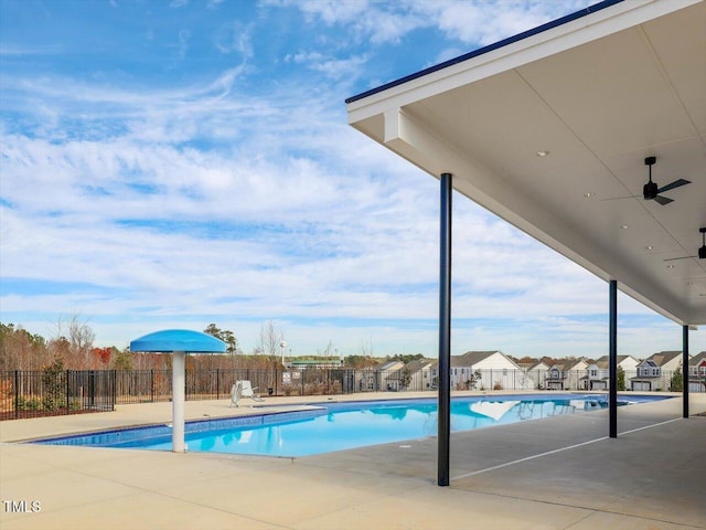 view of pool featuring a fenced in pool, fence, and a ceiling fan