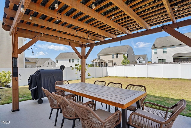 view of patio with a fenced backyard, outdoor dining space, area for grilling, and a residential view