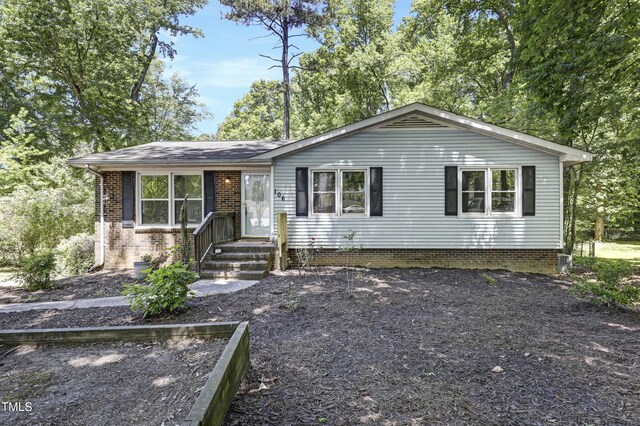 view of front of home with brick siding