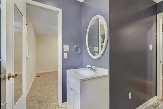 bathroom with baseboards and vanity