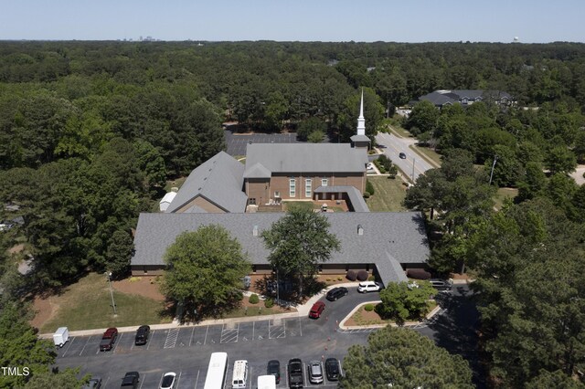bird's eye view featuring a wooded view