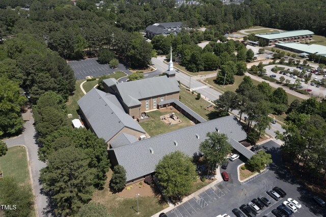 drone / aerial view featuring a forest view