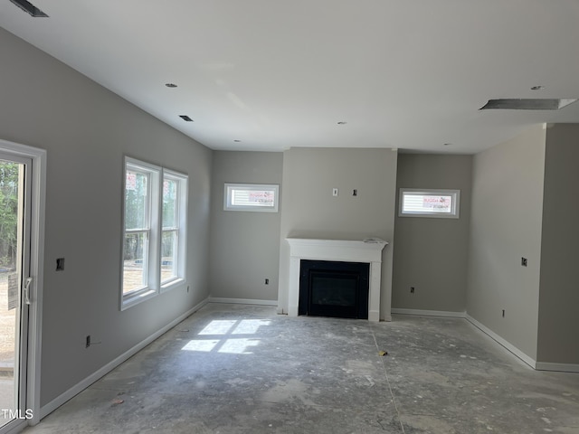 169 Pecan Valley Way, Four Oaks, NC 27524 - unfurnished living room featuring a fireplace and baseboards
