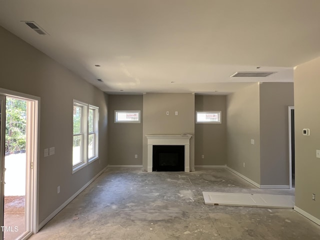 169 Pecan Valley Way, Four Oaks, NC 27524 - unfurnished living room featuring healthy amount of natural light, a fireplace, and baseboards