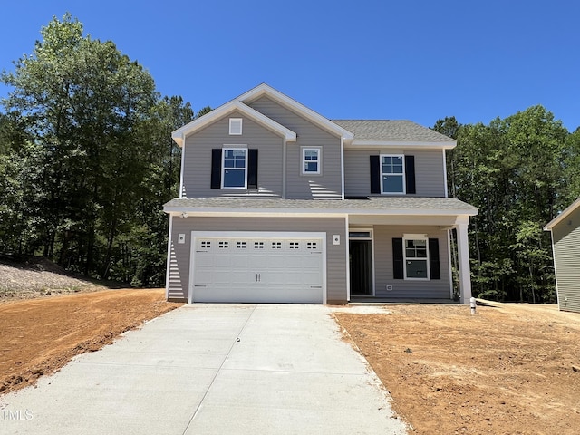169 Pecan Valley Way, Four Oaks, NC 27524 - view of front of home with driveway, an attached garage, and covered porch