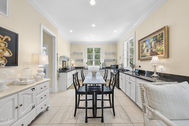 dining room featuring crown molding, recessed lighting, light tile patterned flooring, and visible vents