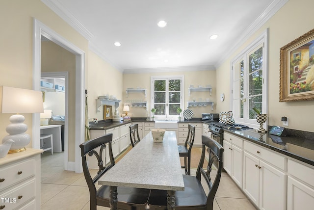 dining room with light tile patterned floors, ornamental molding, and recessed lighting