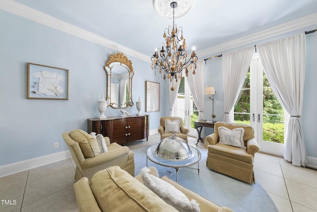 sitting room with tile patterned flooring, baseboards, crown molding, and an inviting chandelier