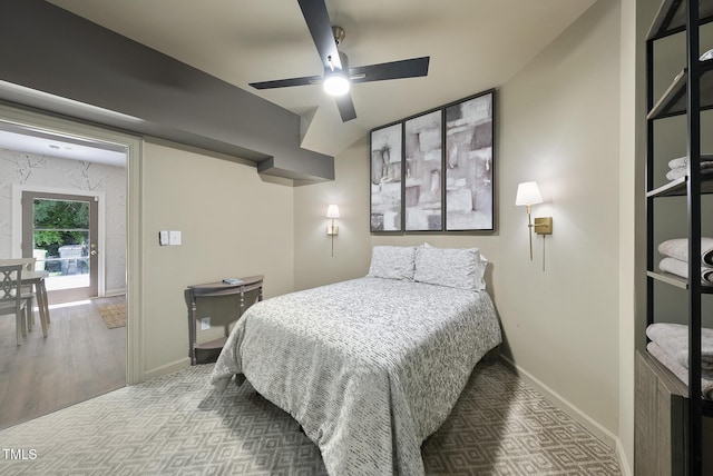 bedroom featuring baseboards, a ceiling fan, and carpet flooring