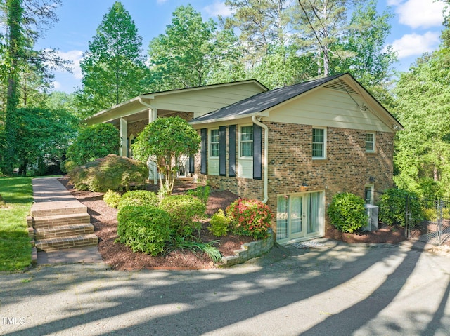 3420 Sheridan Dr, Durham, NC 27707 - view of front of house featuring brick siding and view of wooded area