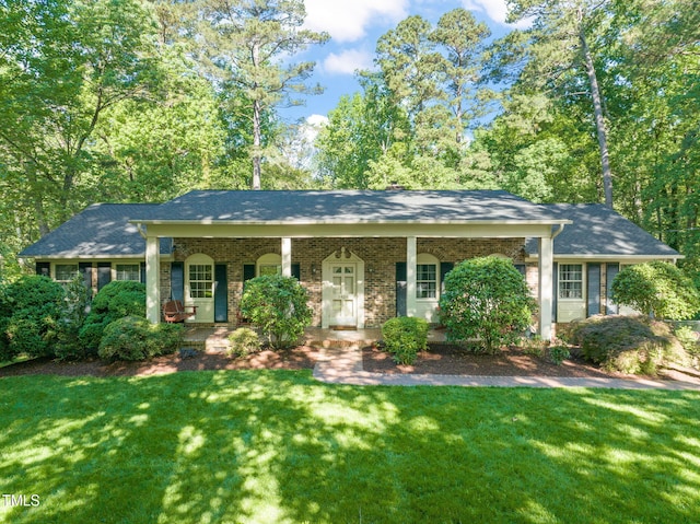 3420 Sheridan Dr, Durham, NC 27707 - view of front facade featuring a front yard, a porch, and brick siding