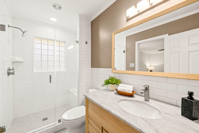 3420 Sheridan Dr, Durham, NC 27707 - bathroom with vanity, toilet, a stall shower, ornamental molding, and tile walls