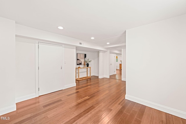 3420 Sheridan Dr, Durham, NC 27707 - unfurnished living room featuring recessed lighting, light wood-style floors, and baseboards