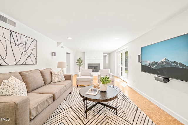 3420 Sheridan Dr, Durham, NC 27707 - living area featuring a fireplace, recessed lighting, baseboards, and light wood-style flooring