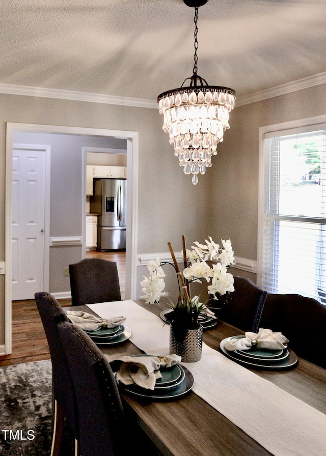 3832 Doeskin Dr, Apex, NC 27539 - dining room with wood finished floors, ornamental molding, and a chandelier