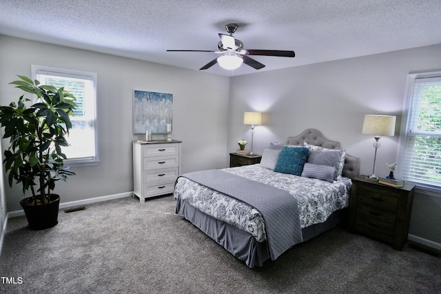3832 Doeskin Dr, Apex, NC 27539 - carpeted bedroom featuring a textured ceiling, ceiling fan, and baseboards