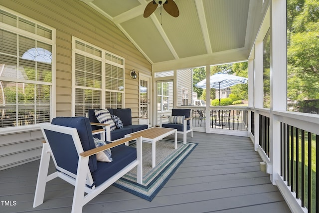 wooden deck with ceiling fan and an outdoor living space