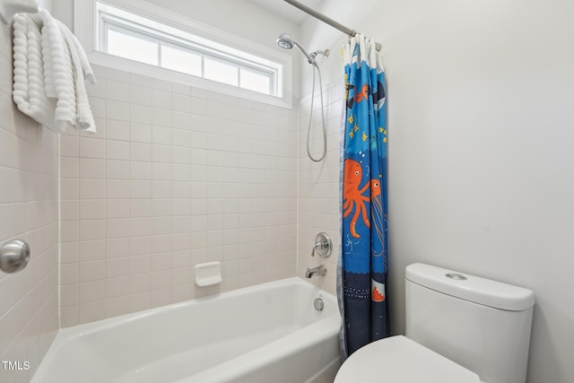 bathroom with shower / bath combo with shower curtain and toilet