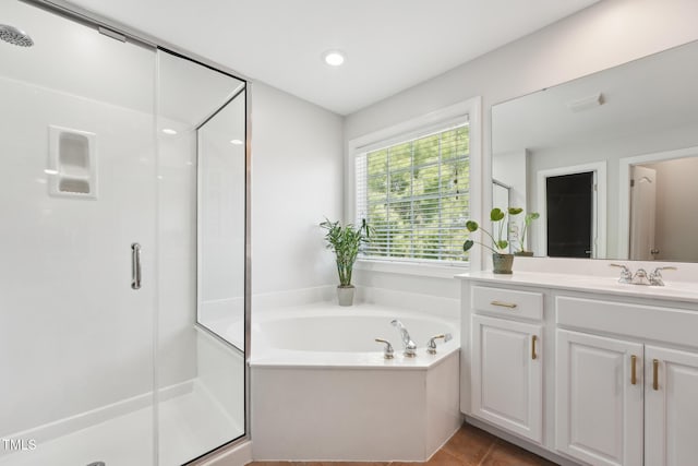 bathroom featuring vanity, tile patterned floors, visible vents, a garden tub, and a stall shower