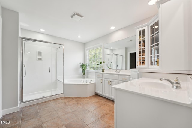 full bath with recessed lighting, two vanities, visible vents, a garden tub, and a stall shower