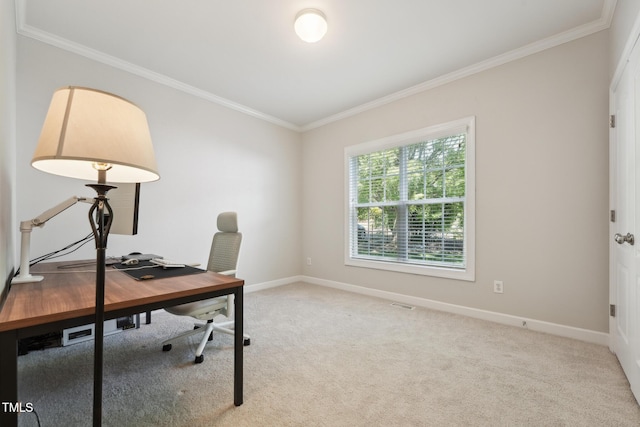 office space featuring crown molding, carpet flooring, baseboards, and visible vents