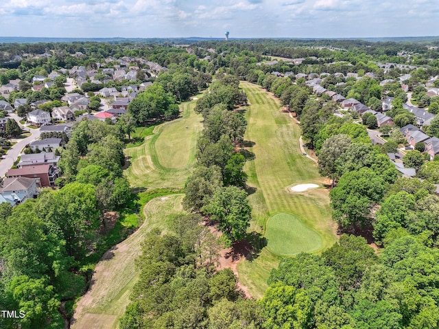 drone / aerial view with view of golf course and a residential view