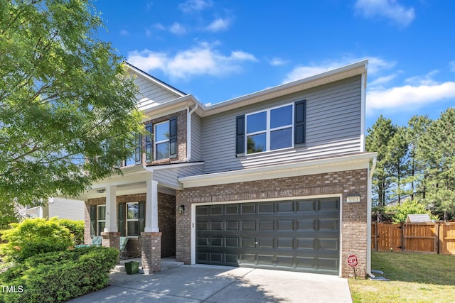 3801 Althorp Dr, Raleigh, NC 27616 - view of front of home featuring fence, a garage, driveway, and brick siding
