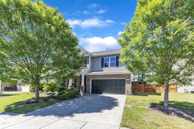 3801 Althorp Dr, Raleigh, NC 27616 - view of front of home with driveway, a front yard, a garage, brick siding, and fence