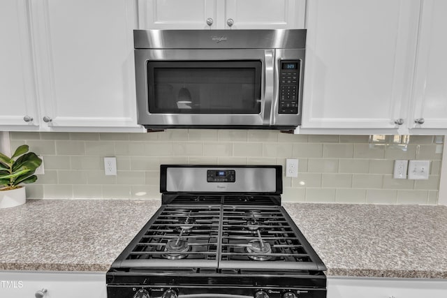 3801 Althorp Dr, Raleigh, NC 27616 - kitchen featuring white cabinets, appliances with stainless steel finishes, and light countertops