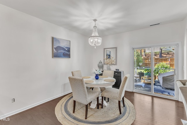 3801 Althorp Dr, Raleigh, NC 27616 - dining room with an inviting chandelier, baseboards, dark wood-style flooring, and visible vents