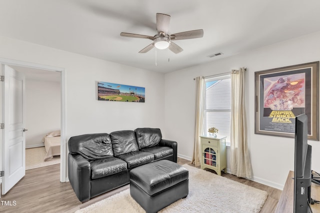 3801 Althorp Dr, Raleigh, NC 27616 - living area featuring ceiling fan, visible vents, baseboards, and light wood finished floors