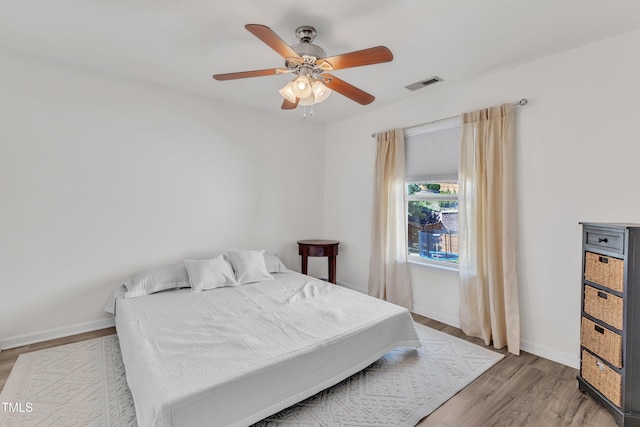 3801 Althorp Dr, Raleigh, NC 27616 - bedroom with baseboards, visible vents, ceiling fan, and light wood-style floors