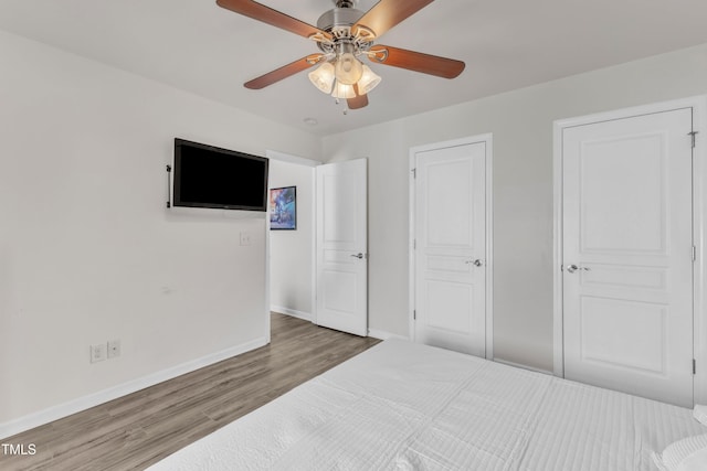 3801 Althorp Dr, Raleigh, NC 27616 - bedroom with baseboards, a ceiling fan, and wood finished floors